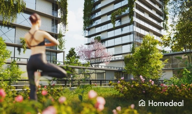Modern woongebouw met een groendak, verticale beplanting en een groene binnentuin waar een persoon yoga doet. Het groendak draagt bij aan een duurzame, natuurlijke en klimaatbestendige leefomgeving.